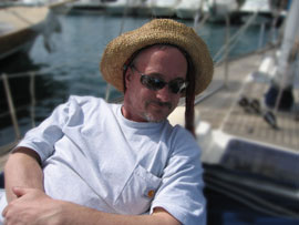 Chris looking comfortable in a lady's hat